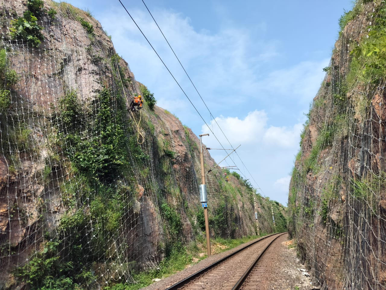 Rockfall protection contractor installing barrier and mesh systems in India